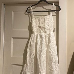 Long baby doll dress with back cut out. Never worn
